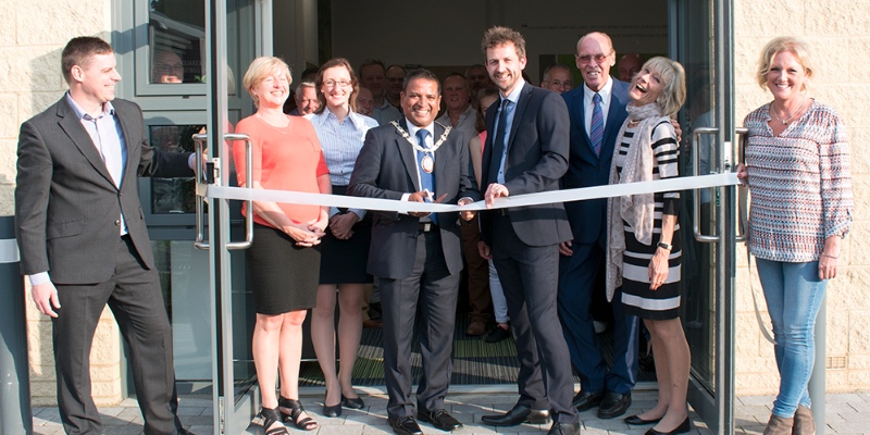 Office Changes Rebrand Open Evening Ribbon being cut SM