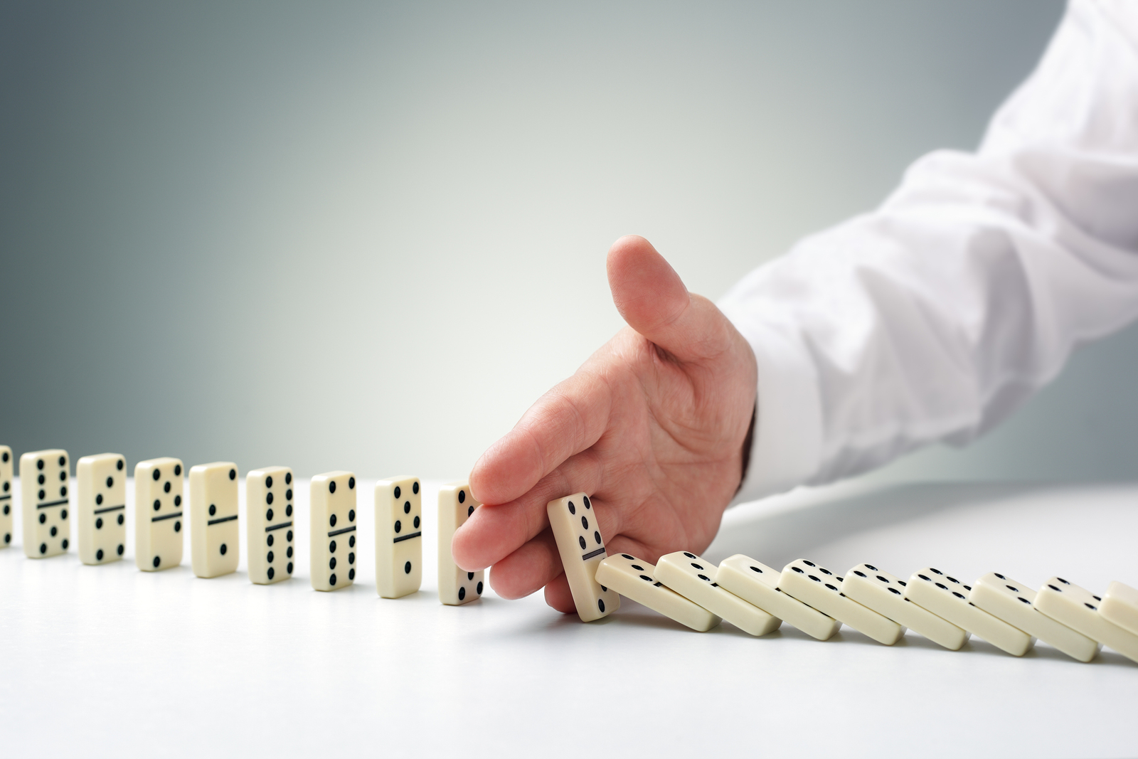 bigstock Stopping the domino effect con