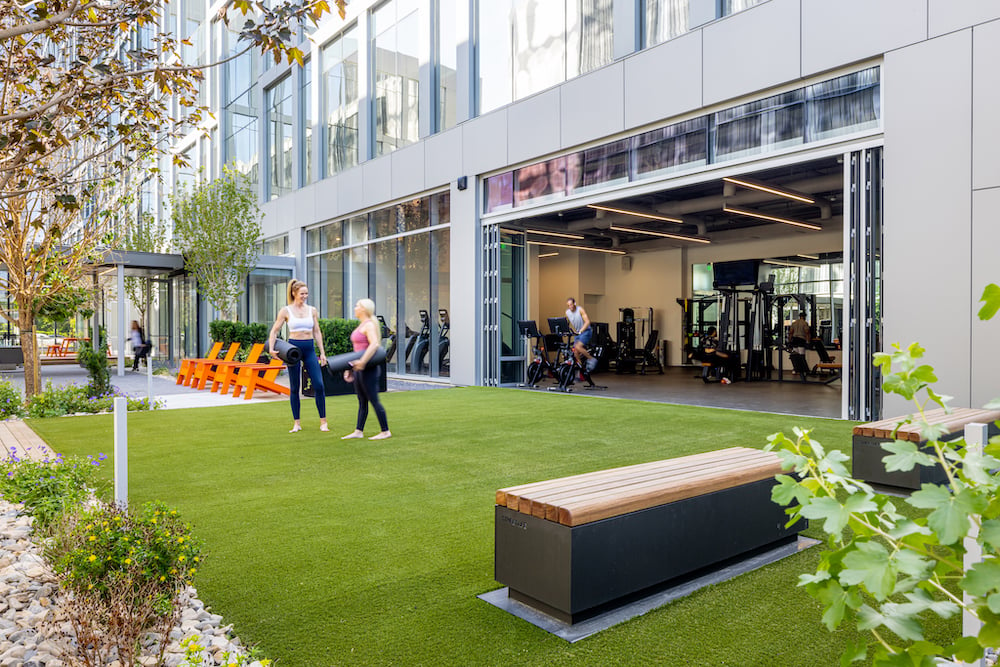 A fitness center opens onto an active courtyard at 650 Main Street in Salt Lake City. 