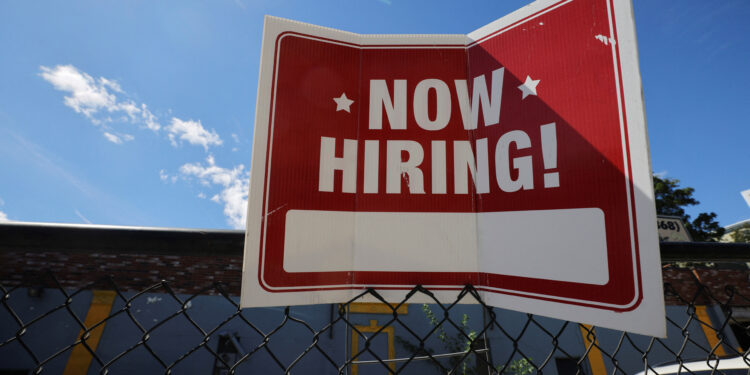 A "now hiring" sign is displayed in Somerville