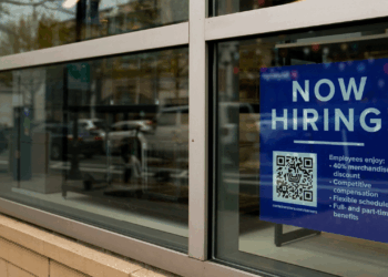 An employee hiring sign with a QR code is seen in a window of a business in Arlington, Virginia, U.S., April 7, 2023. REUTERSElizabeth Frantz