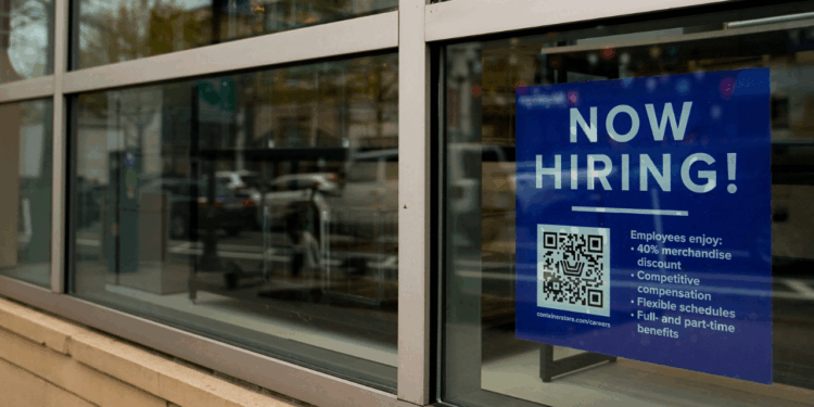An employee hiring sign with a QR code is seen in a window of a business in Arlington, Virginia, U.S., April 7, 2023. REUTERSElizabeth Frantz