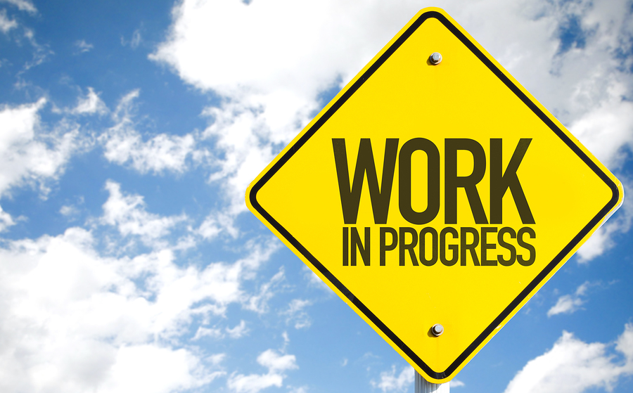 Work In Progress sign with sky background